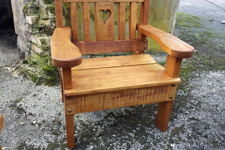 Carver chair with heart cutout in the backrest