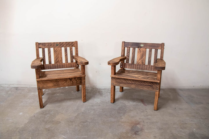 Macrocarpa outdoor carver chairs on a deck