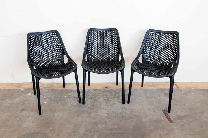 Three Black Bean resin chairs in black