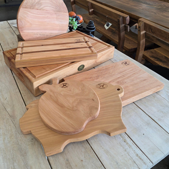 Macrocarpa chopping boards in several shapes on a table