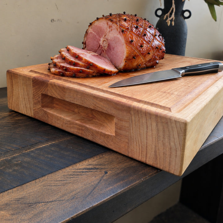Christmas ham carved on a macrocarpa chef's board