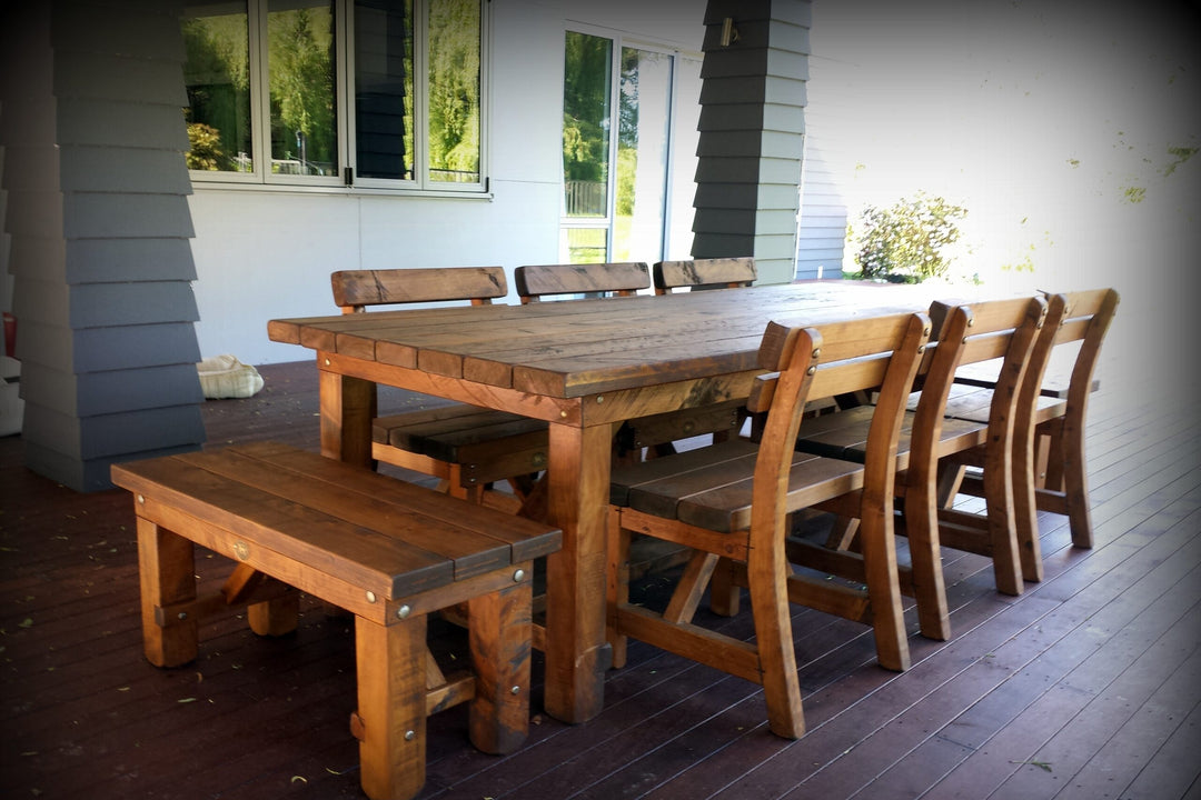 Pew chairs and carvers around a Pioneer table on a deck