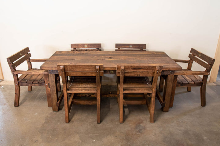 2m Pioneer outdoor table with pew and carver chairs