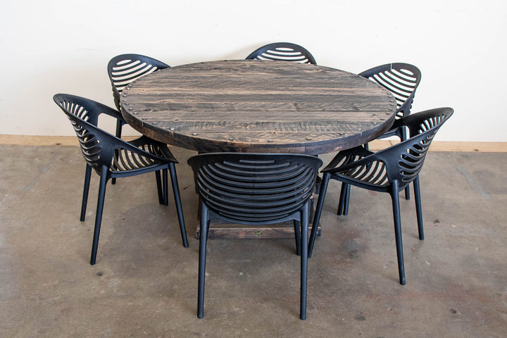 Round Woolpress outdoor table in Charcoal macrocarpa