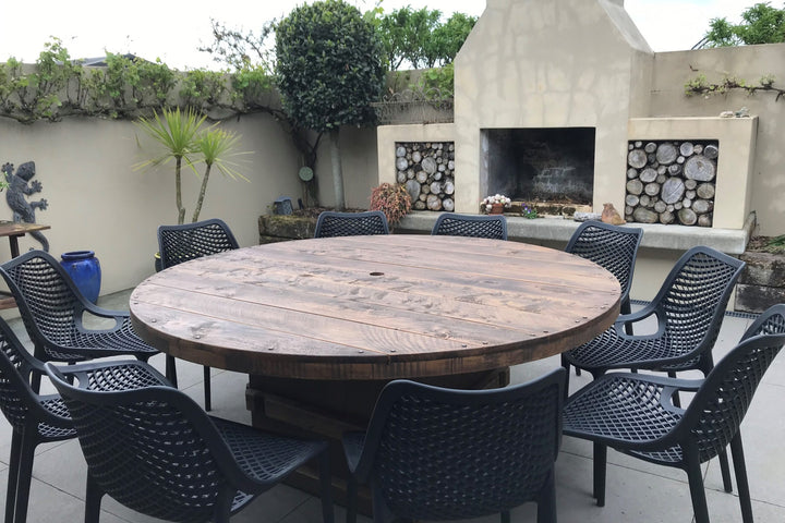 1.8m round Woolpress table in Antique Brown macrocarpa