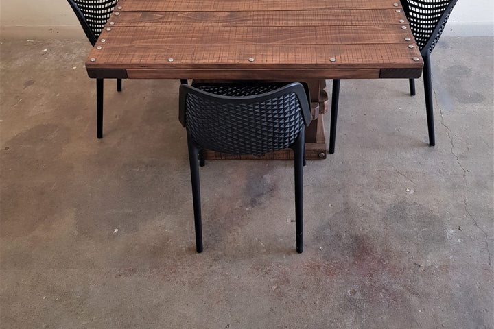 Square Woolpress table from above with Black Bean chairs